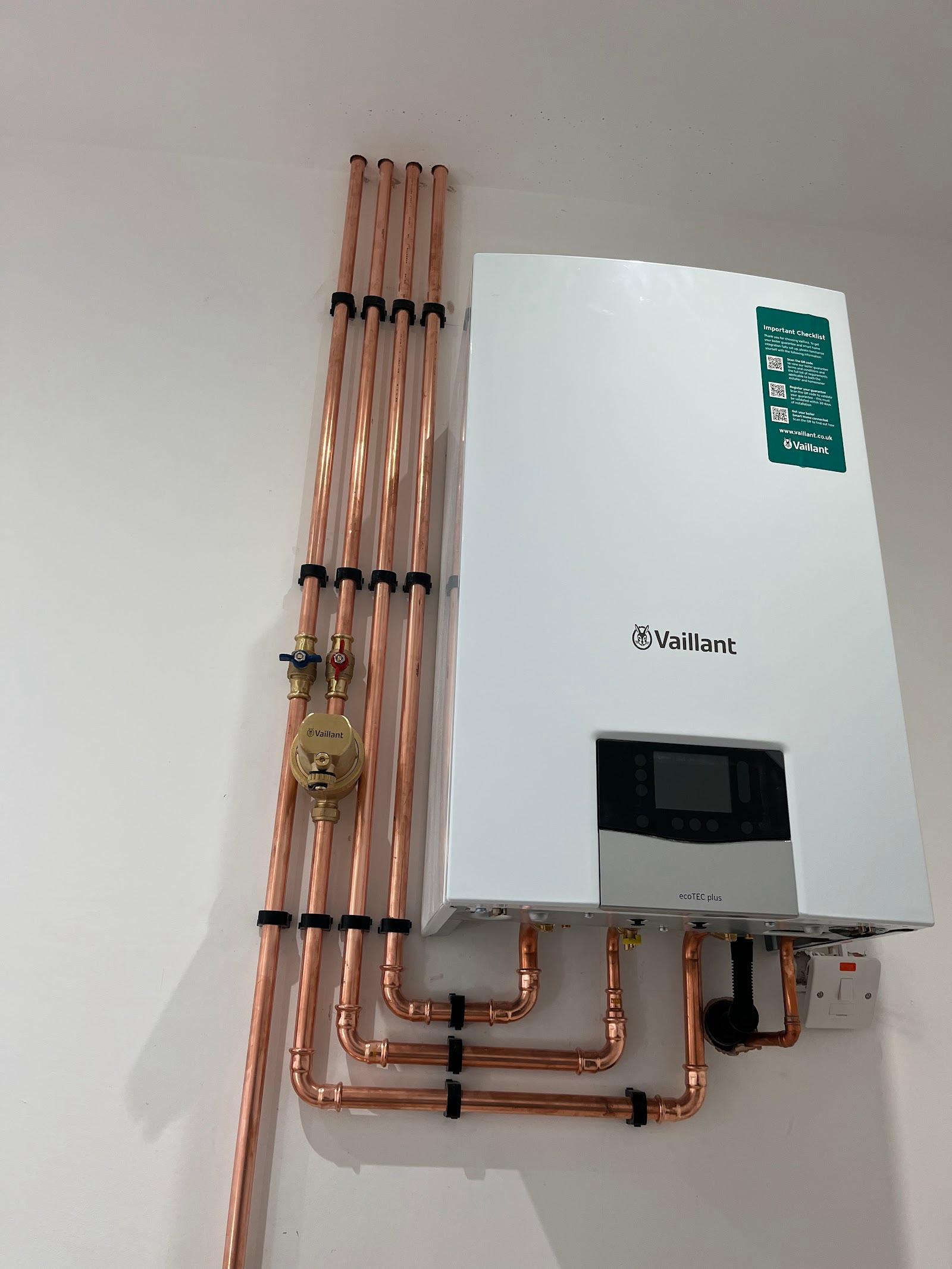 A new Vaillant boiler with straight copper pipe drops and an isolation valve